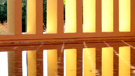 architecture orange patterns pillars reflected on water surface