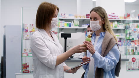 young women talking at the pharmacy