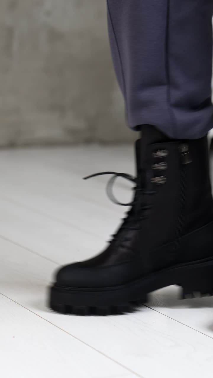 Women footwear showroom. Elegant woman fashion shoes posing. Vertical video