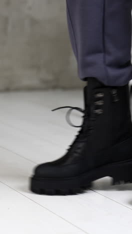 women footwear showroom. elegant woman fashion shoes posing. vertical video