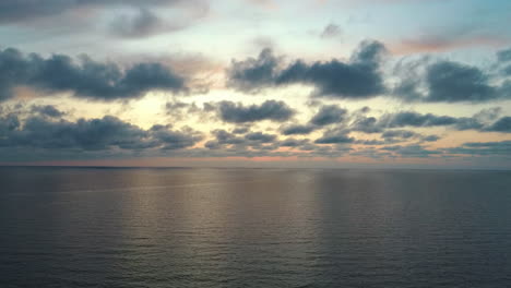 static dron flying over seaafter sunset