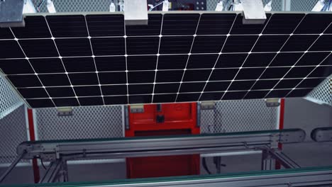 production of new solar panels. automated equipment inside the modern robotic manufacturing. innovative factory indoors.