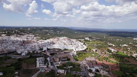 aerial landscape of white ancient city ostuni on a sunny day with blue sky, italy, apulia
