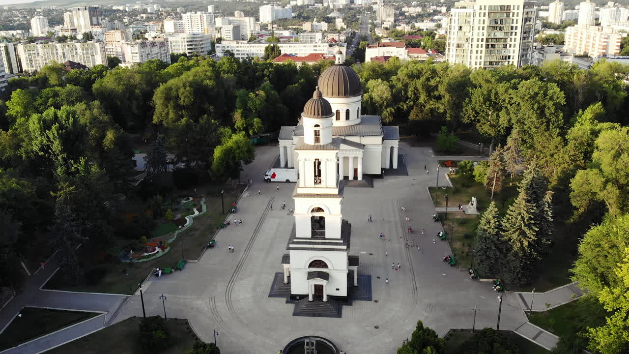 Chisinau, Moldova - June 14, 2021: Aerial drone view showing the Nativity Cathedral and bell tower surrounded by trees and city buildings in Chisinau, Moldova