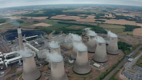 Wide-descending-establishing-drone-shot-of-Power-station-cooling-towers