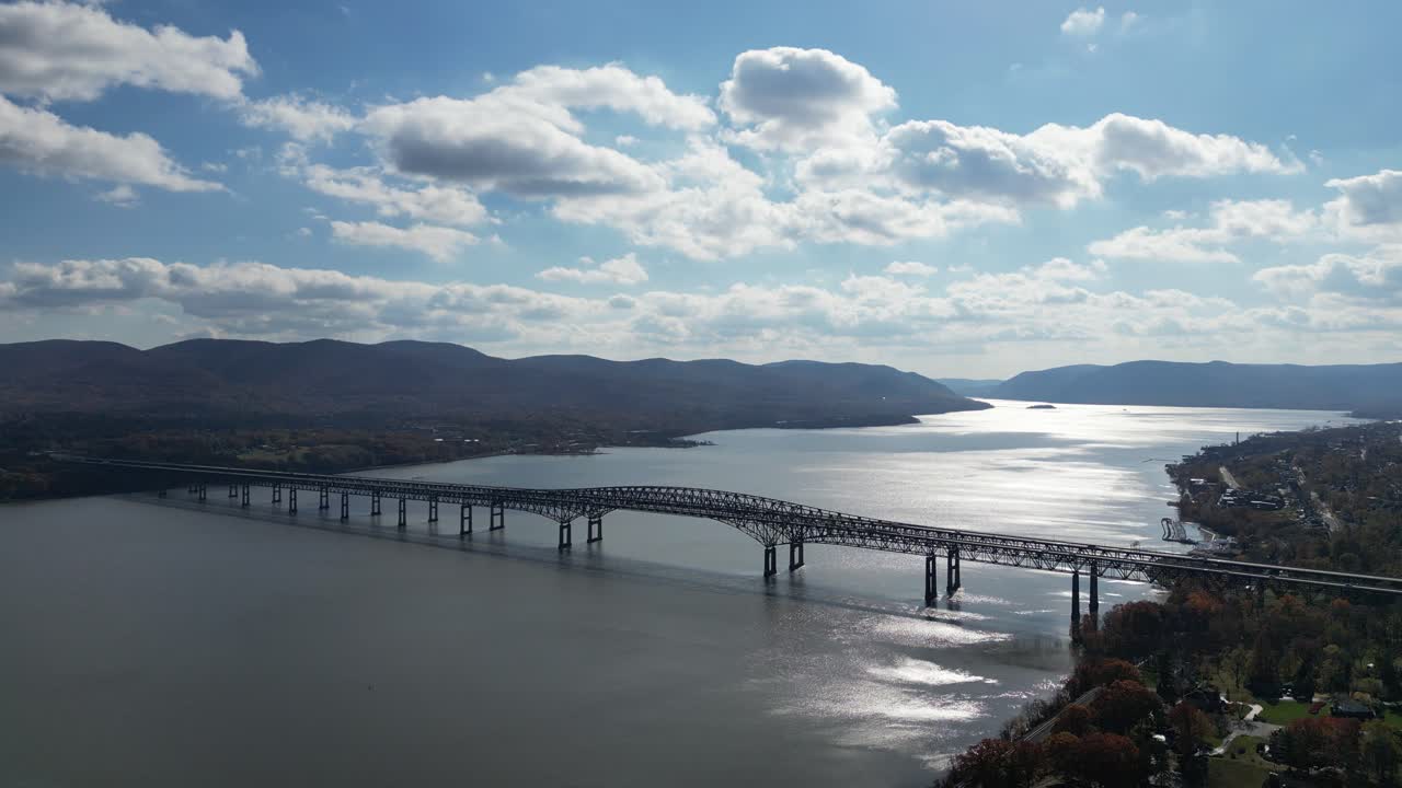 Drone path gliding above Newburgh coastline, forest edges, and hillside layout offering balanced scenic elements for travel stock needs