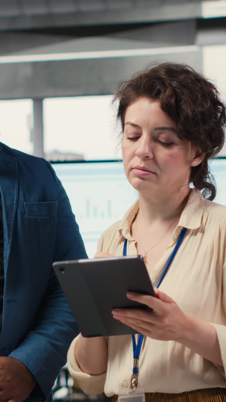 Vertical Video Diverse workers team use digital tools and analytics to improve growth strategy