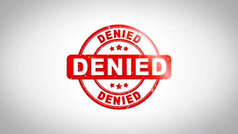 denied signed stamping text wooden stamp animation. red ink on clean white paper surface background with green matte background included.