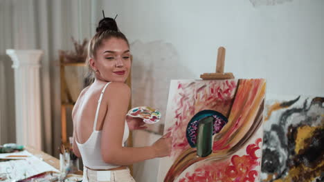 young woman creating an artwork indoors