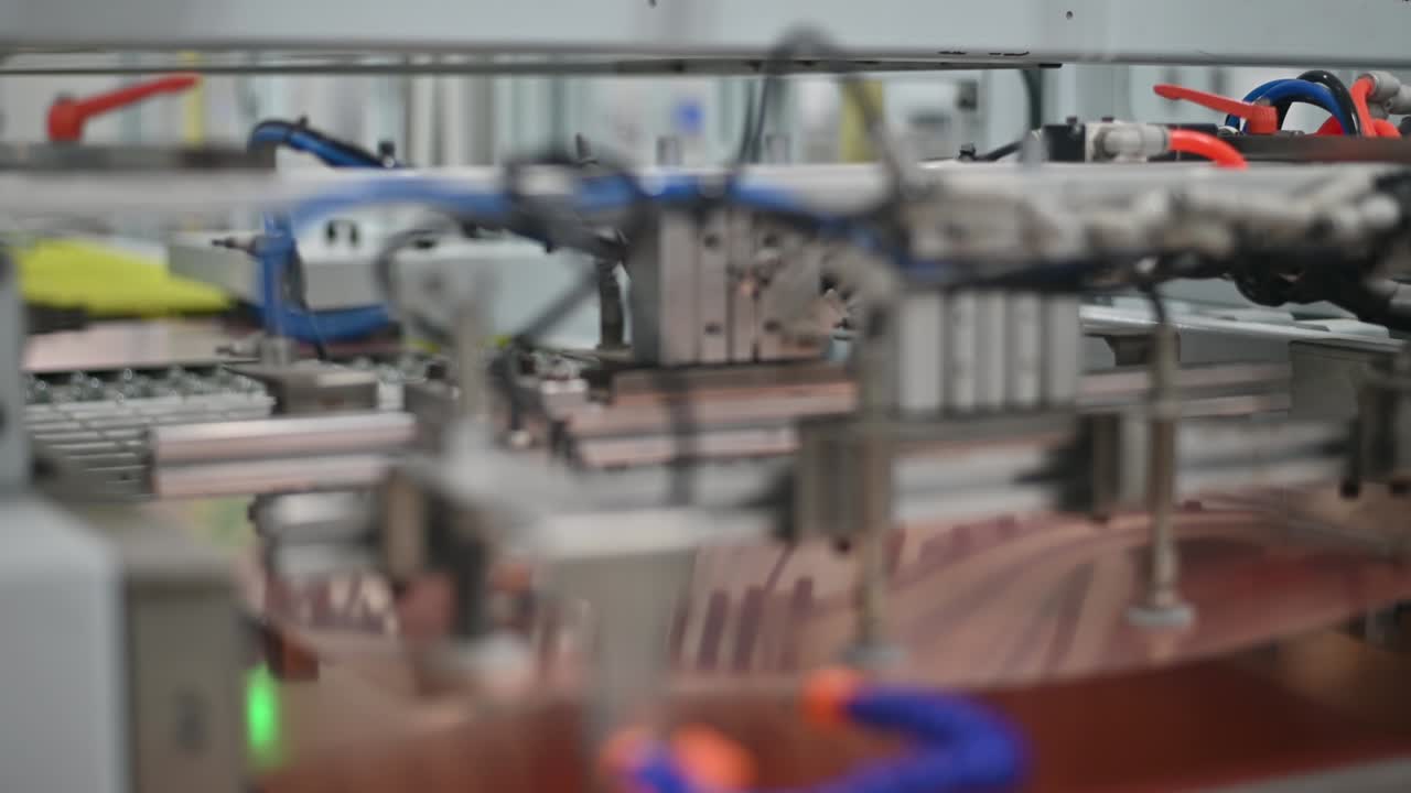 PCB BOARD COPPER in production at automatic conveyor belt of factory line. High tech machinery plant using ecology materials