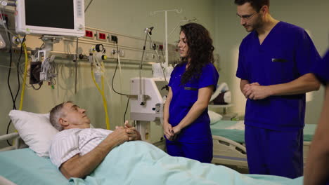 medical staff attending to patient in hospital