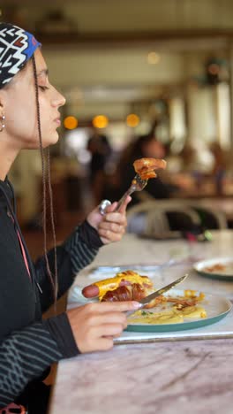 woman eating breakfast in a cafe