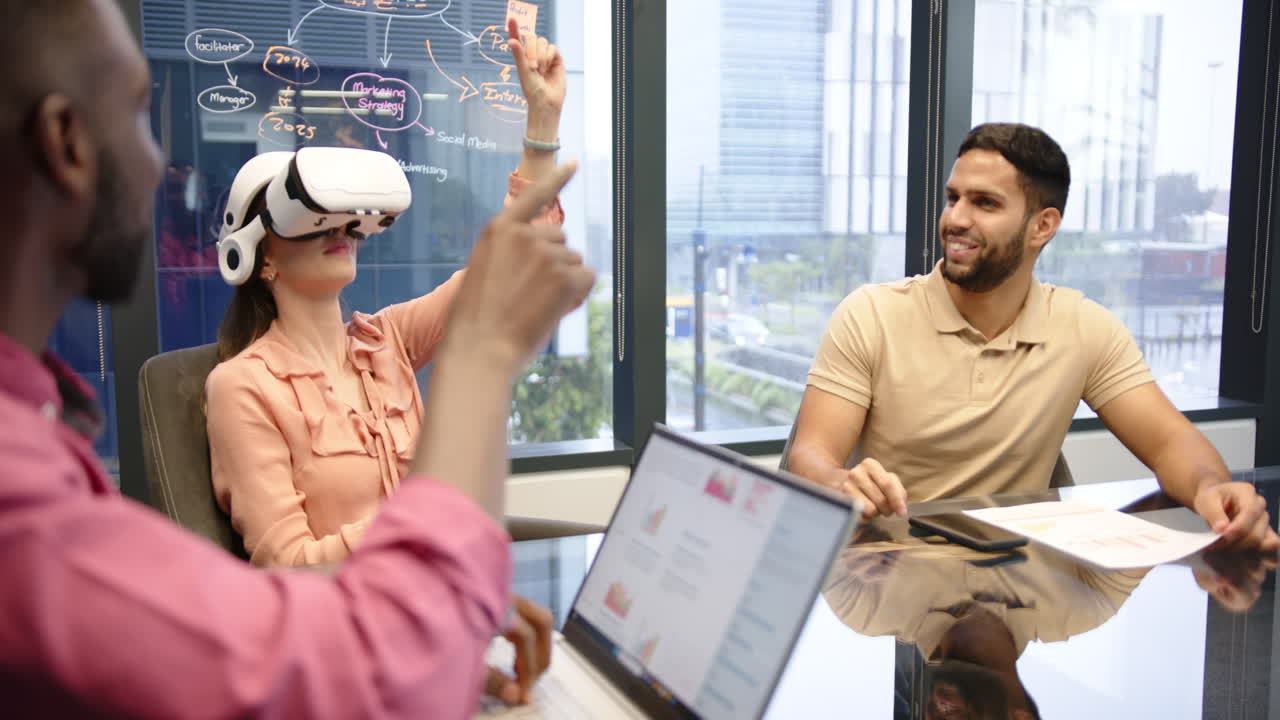 Using VR headset, woman in office meeting with multiracial colleagues, discussing project