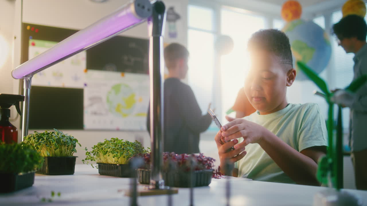 Student in science classroom learning about plants