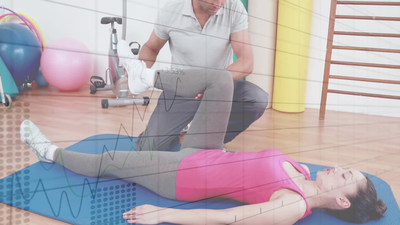 When checking leg alignment, physio trainer raising and bending client's leg on mat assessing range