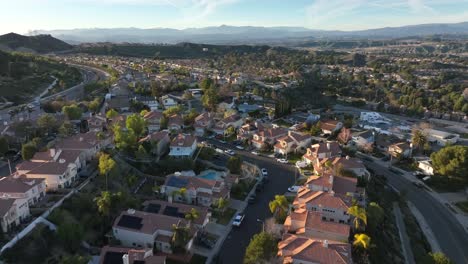 aerial view flying over santa clarita california neighborhood real estate during the day