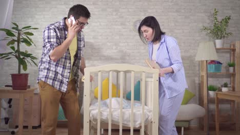 worried young parent in the nursery newborn's bed close up