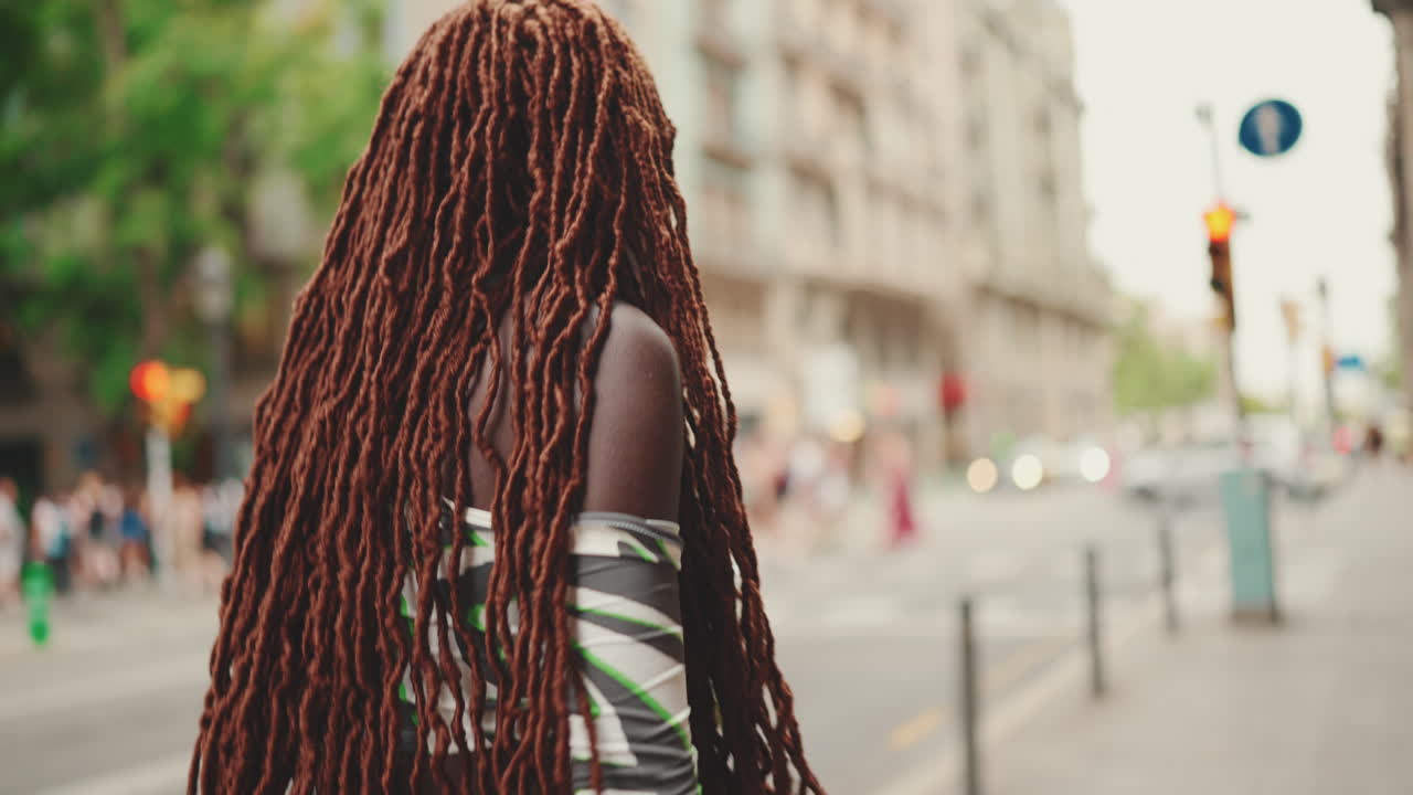 Woman with Dreadlocks in Urban Setting