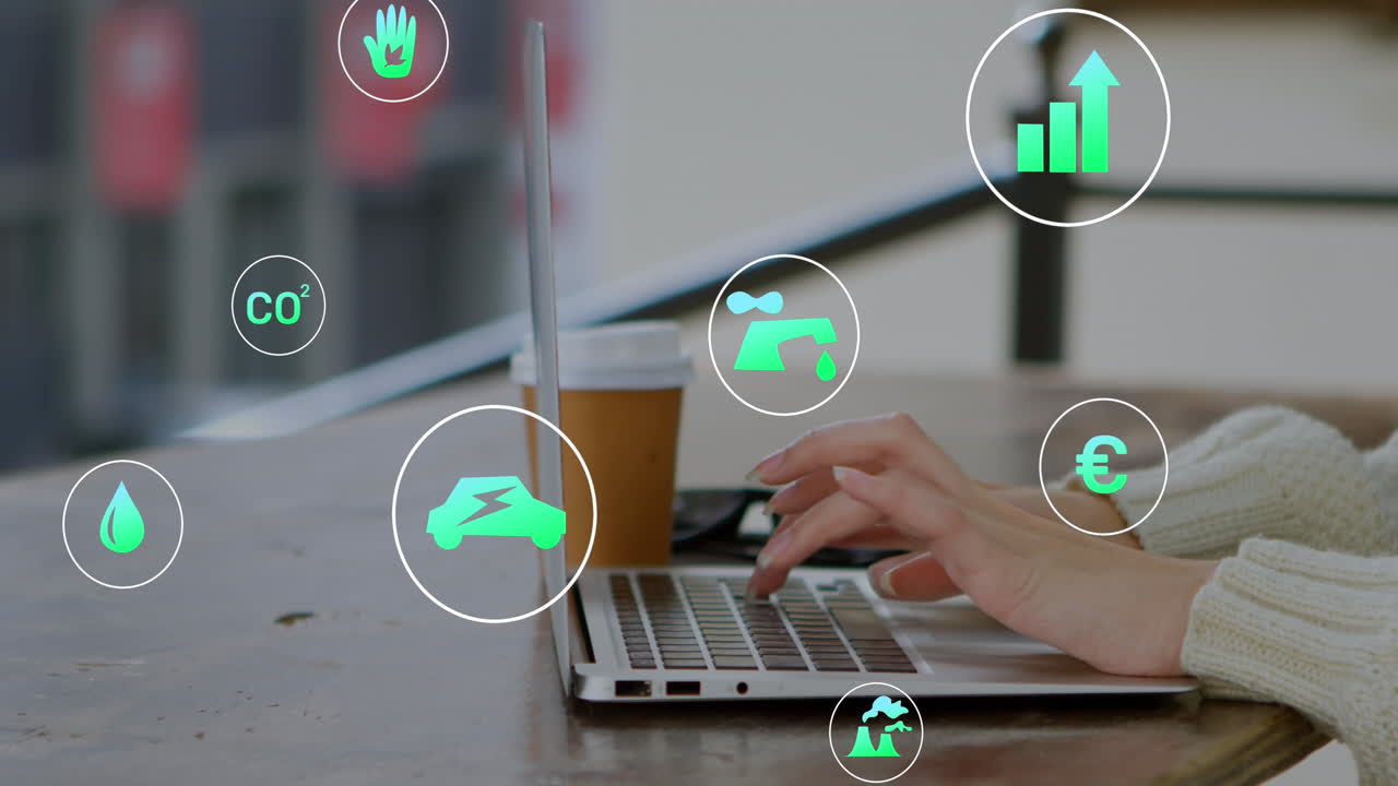 animación de múltiples iconos sobre manos recortadas de una mujer caucásica trabajando en una computadora portátil en cafés