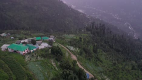 aerial shot revealing sunset in mountains with pink hues