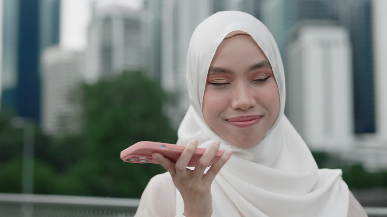 Woman in Hijab Talking on Phone in City