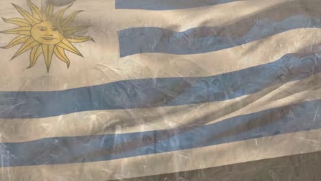 Animación-De-La-Bandera-De-Uruguay-Ondeando-Sobre-Un-Campo-De-Trigo.