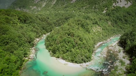 aerial view of the calm and transparent water at the soca river in slovenia.