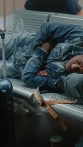 sleeping passenger at airport