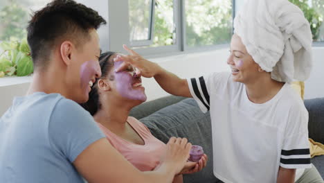 young asian man and biracial women enjoy a spa day at home