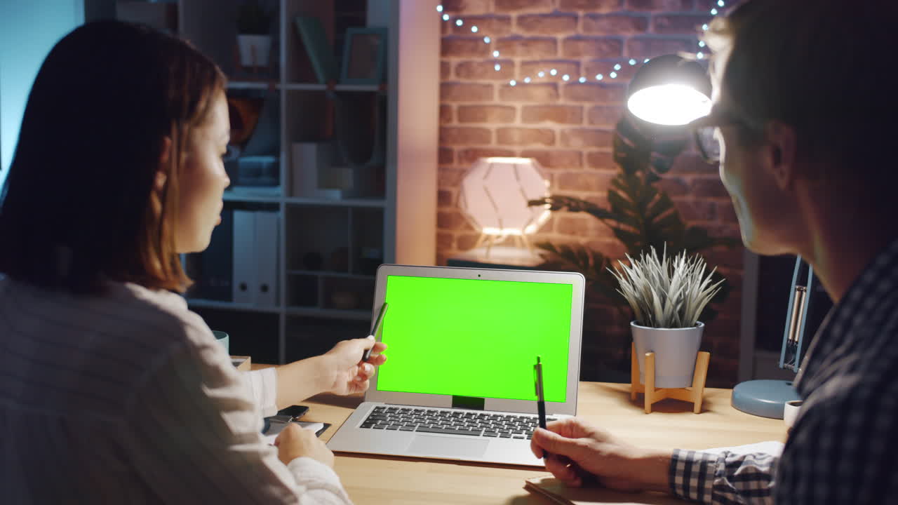 People collaborating on a video call at home