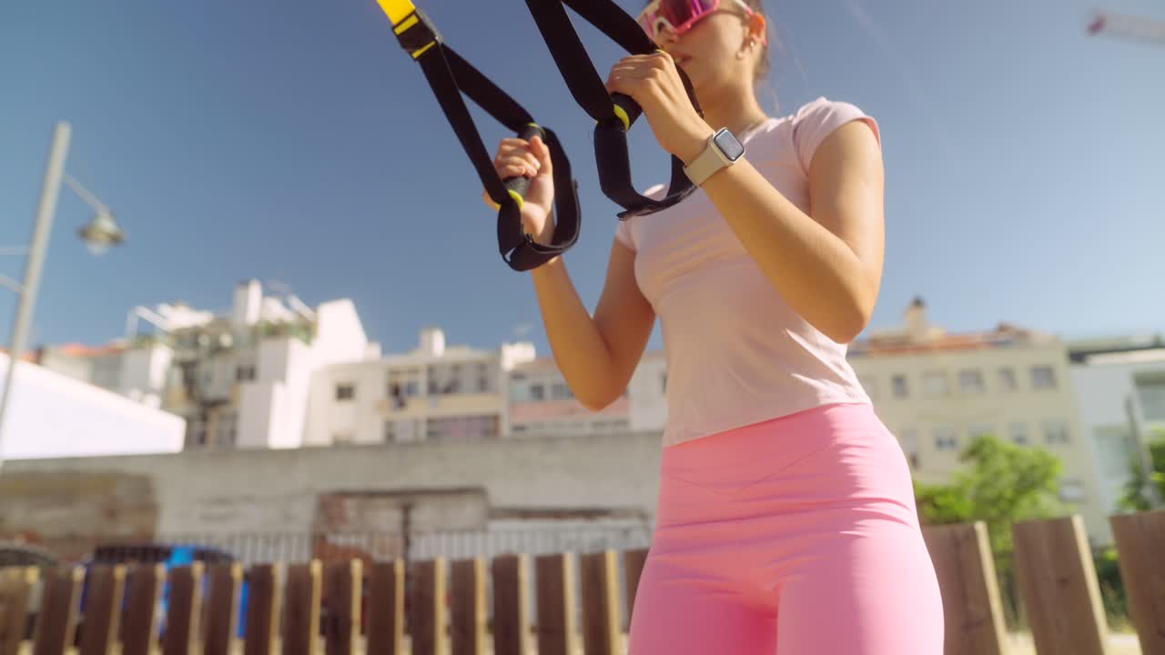 Woman working out with resistance bands outdoors