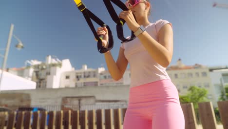 woman working out with resistance bands outdoors