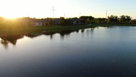 Rising-up-from-lakeside-homes-to-reveal-a-beautiful-sunset