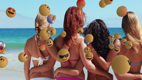 women in swimsuits at beach with floating emoji animations around them