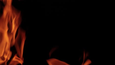 flames of fire on black background in slow motion