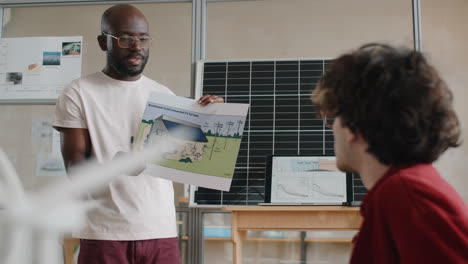 black engineer explaining project of renewable energy for home