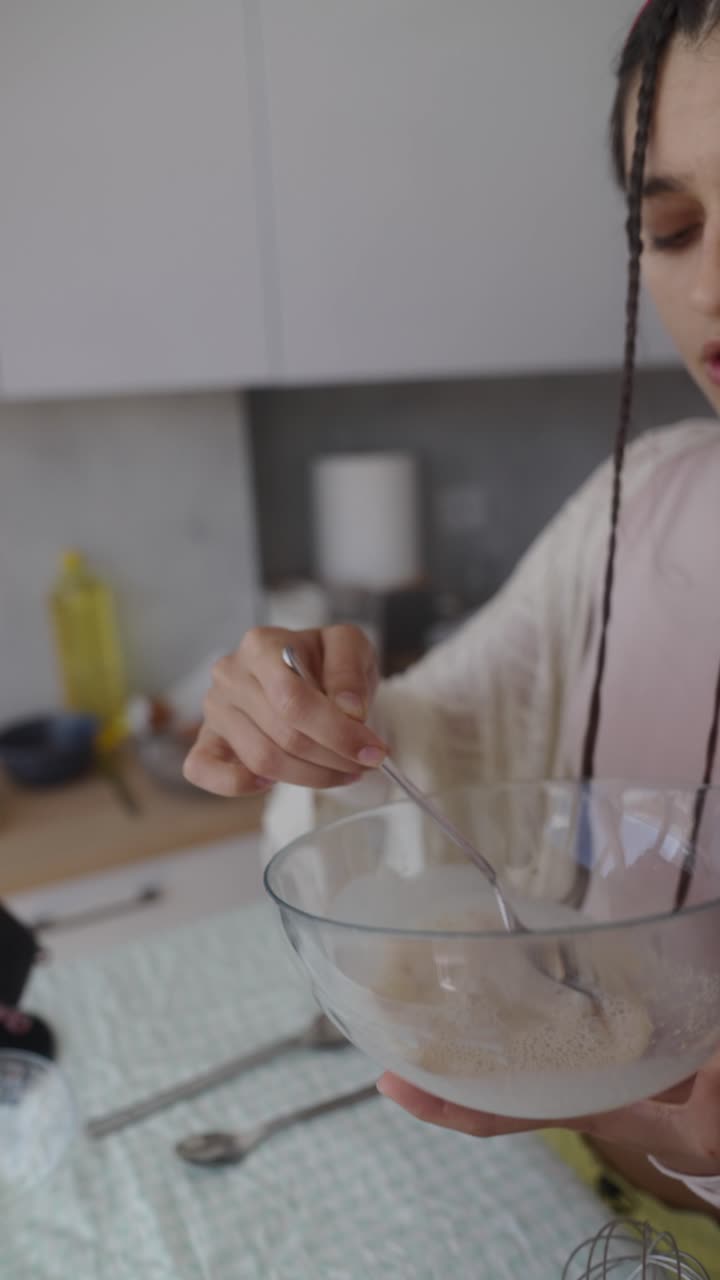 Woman Mixing Ingredients in a Bowl