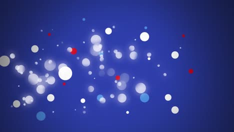 Animation-of-spots-in-red,-white-and-blue-of-flag-of-united-states-of-america-over-blue-background
