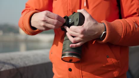 mounting metal plate on professional camera, close-up and slow motion