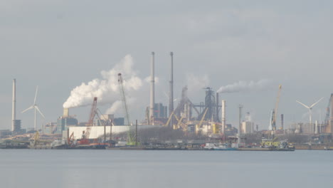 close-shot-of-polluting-industrial-buildings-standing-on-river-shore