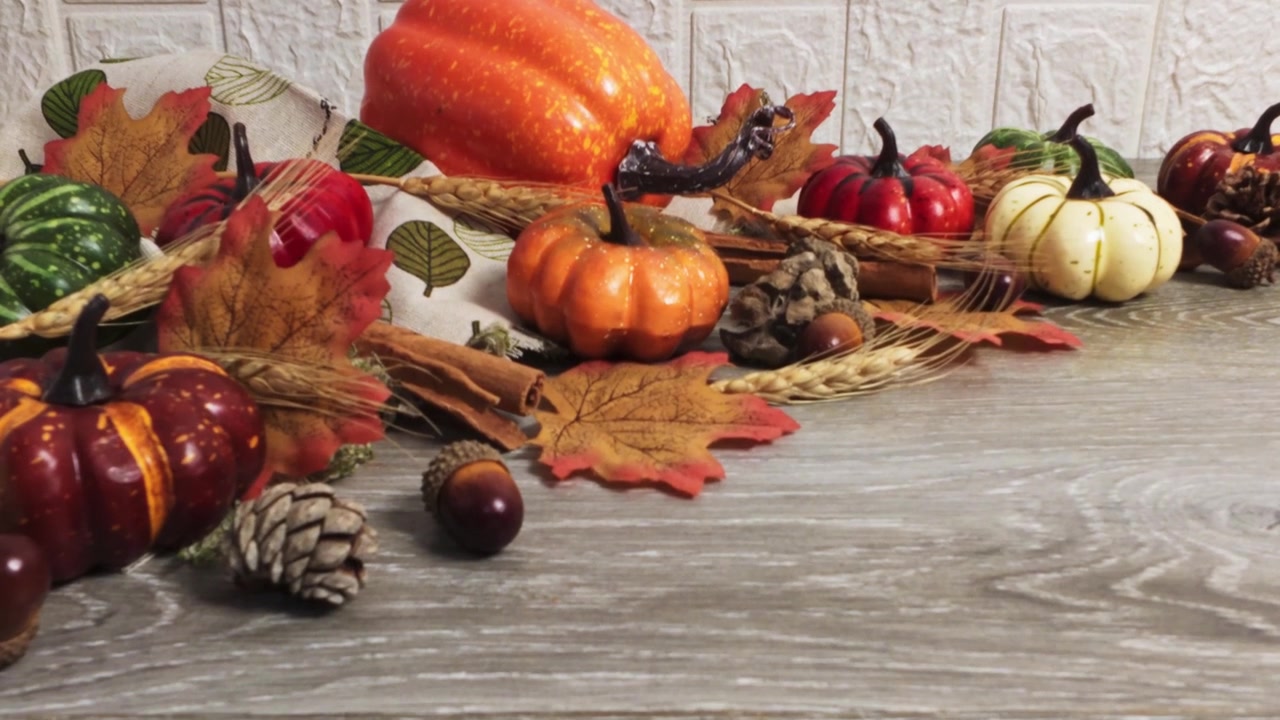 Autumnal Thanksgiving Decoration with Pumpkins and Fall Foliage on Wooden Table