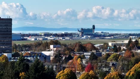 airplane landing on runway of yvr airport in richmond, bc, canada