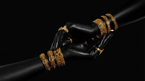 hands adorned with golden bangles and rings