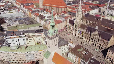 marienplatz, new town hall, st. peter church, and frauenkirche cathedral in munich, germany. - aerial shot