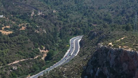 cars travelling on highway that winds through the mountains towards nicosia cyprus