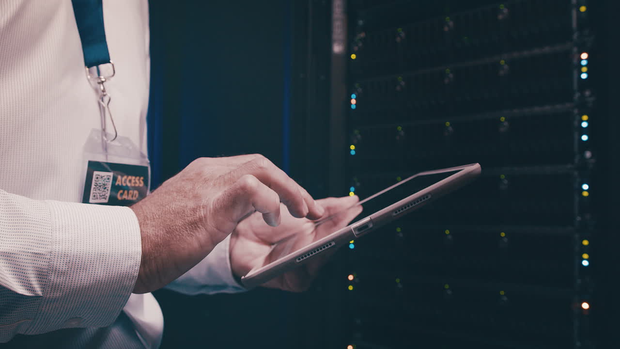 an unrecognisable man using a digital tablet