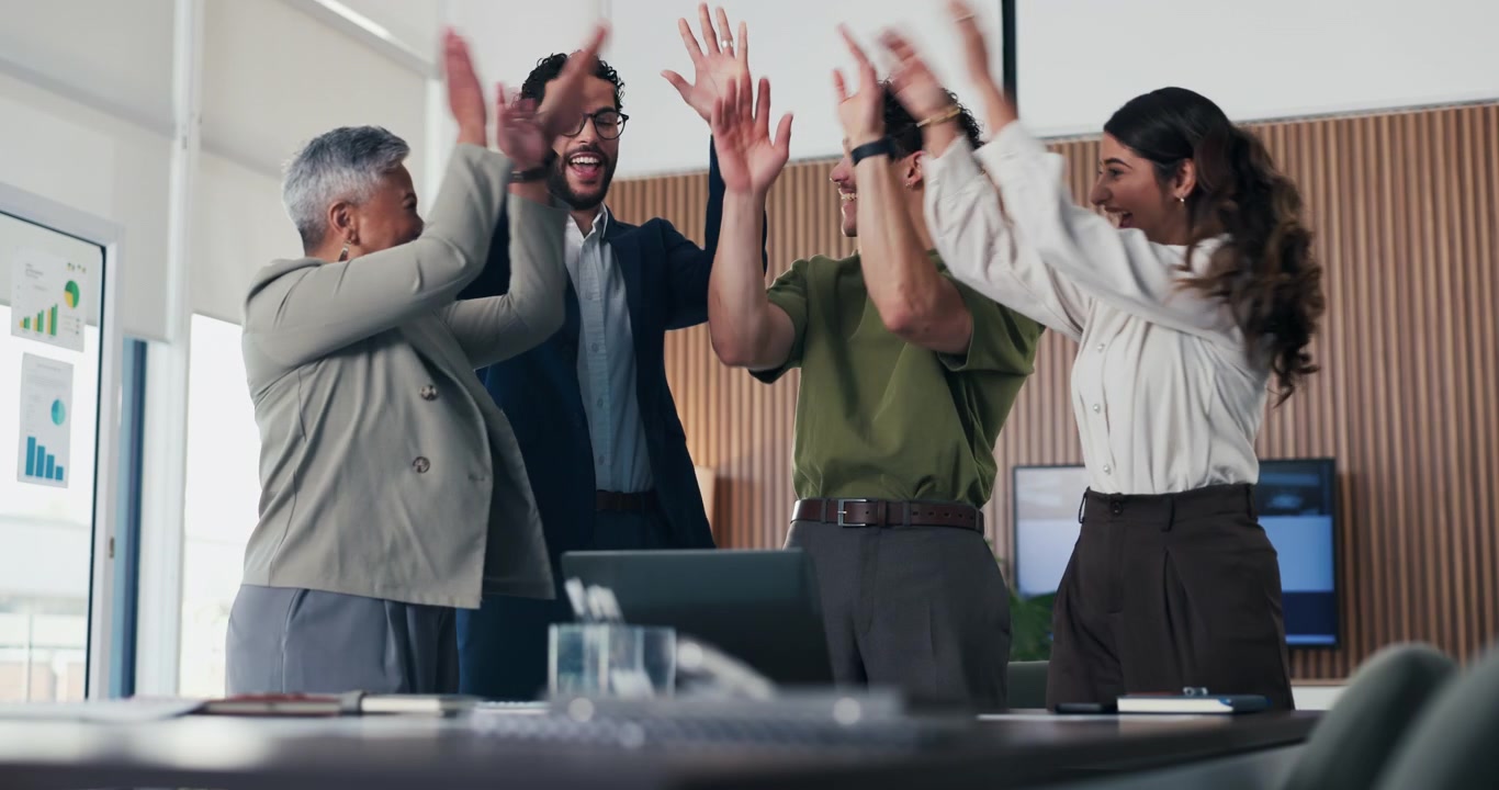 Diverse Business Team Celebrating Success in Modern Office