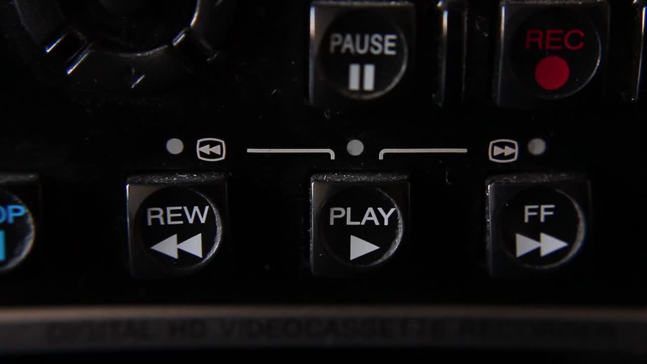Finger Pressing Play Button on Electronic Media Device