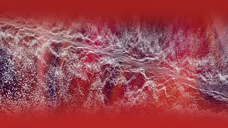 ondas de partículas blancas que se mueven sobre un resplandor rojo en un fondo oscuro