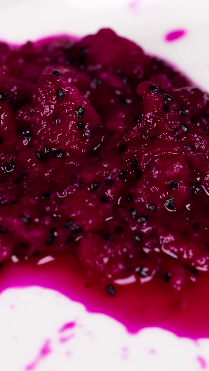 Dragon fruit pulp spread on a white plate